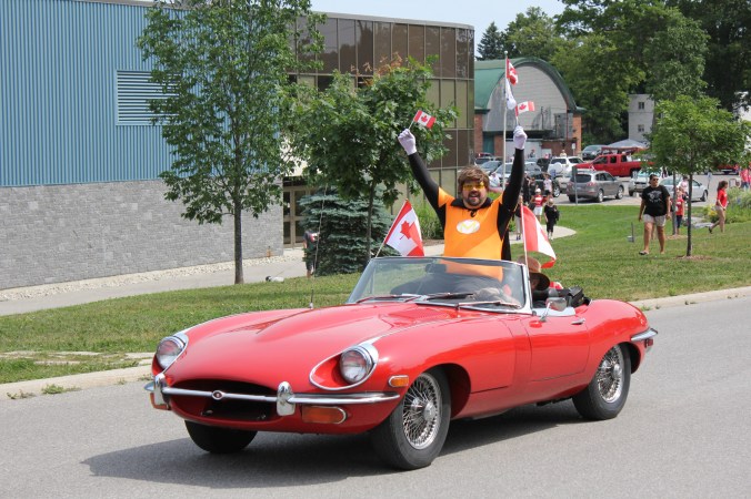 Museum Man waves to the crowd at the Canada Day parade.